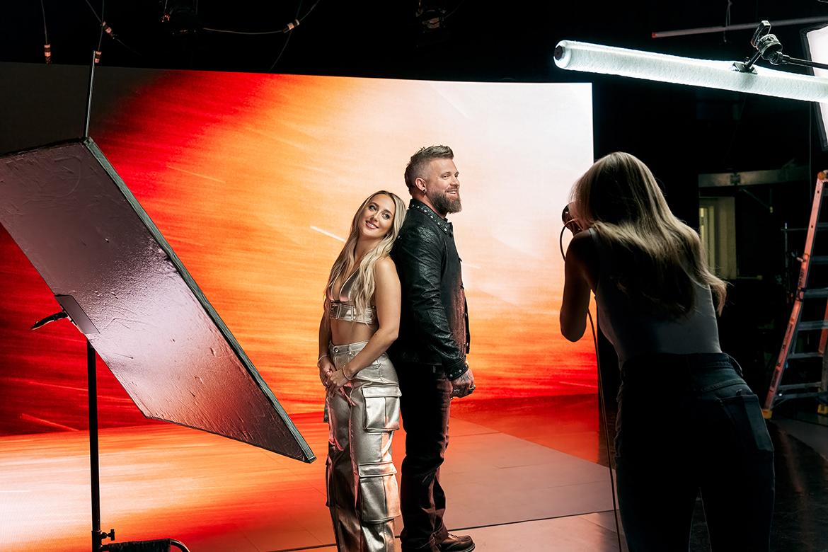 Country singer-songwriters Brantley Gilbert, right, and Ashley Cooke, left, pose during a photo shoot on the extended reality, or XR, stage in Middle Tennessee State University’s College of Media and Entertainment Building in Murfreesboro, Tenn. Gilbert and Cooke shot the music video for the song “Over When We’re Sober” on the $1 million XR stage on Friday, May 24, 2024. The music video was released on Friday, June 21. (MTSU photo by Andy Heidt)