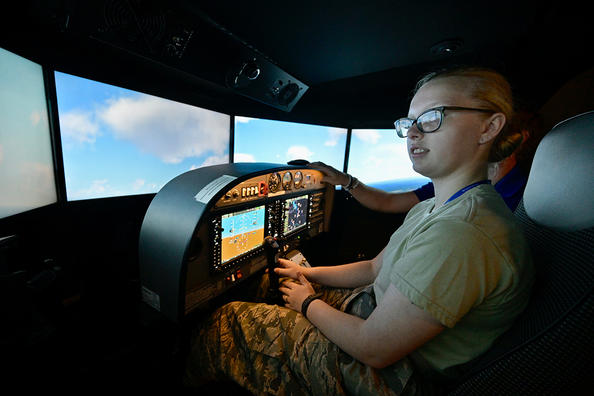 Two Civil Air Patrol cadets use the instrument panels in a Middle Tennessee State University flight simulator at the Aerospace Department's Flight Operations Center on Memorial Boulevard in Murfreesboro, Tenn., to fly the plane Monday, July 8, during their weeklong camp hosted by the MTSU College of Basic and Applied Sciences. From all across the nation, the cadets will visit a number of departments, including data science, chemistry, concrete, engineering technology and more during the week. (MTSU photo by Andy Heidt)