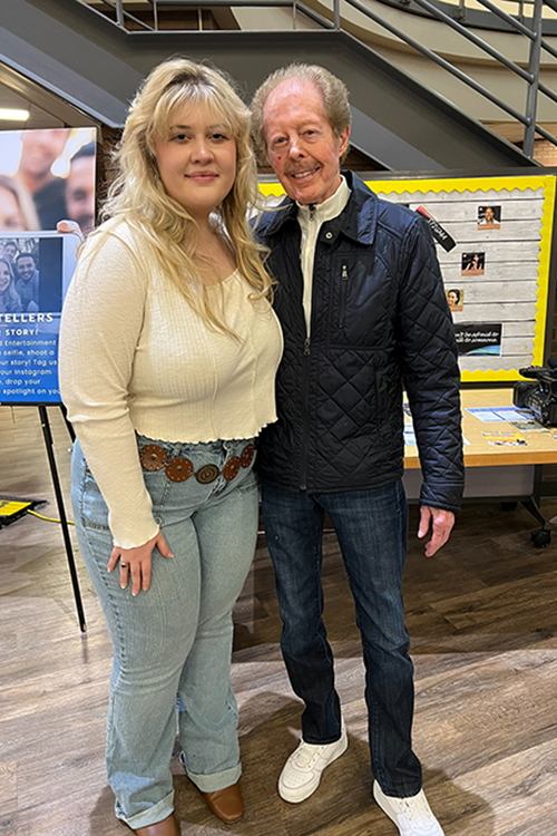 Middle Tennessee State University School of Journalism and Strategic Media alumna and current graduate student Karli Sutton, left, and musician Kenny Lovelace, right, pose for a photo in the John Bragg Media and Entertainment Building in Murfreesboro, Tenn., after an interview.  (Submitted photo)