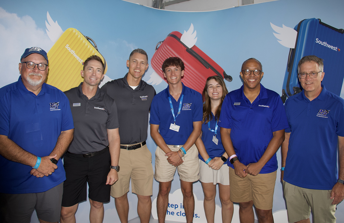 Middle Tennessee State University Provost Mark Byrnes and others from the university’s 2024 EAA AirVenture team meet with officials from Southwest Airlines, representing Destination 225, the company’s pilot recruitment and training program, at the airshow in Oshkosh, Wis. (MTSU photo by Brian Delaney)