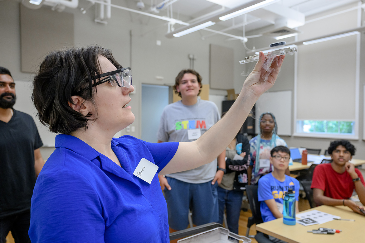 Middle Tennessee State University Physics and Astronomy associate professor Hanna Terletska, foreground, performs a quantum levitation of a superconductor while area high school students watch during the recent MTSU College of Basic and Applied Sciences STEM Camp showcasing science, technology, engineering and math in a Wiser-Patten Science Hall classroom on the MTSU campus in Murfreesboro, Tenn. Forty students attended the five-day camp, which will return next summer. (MTSU photo by J. Intintoli)