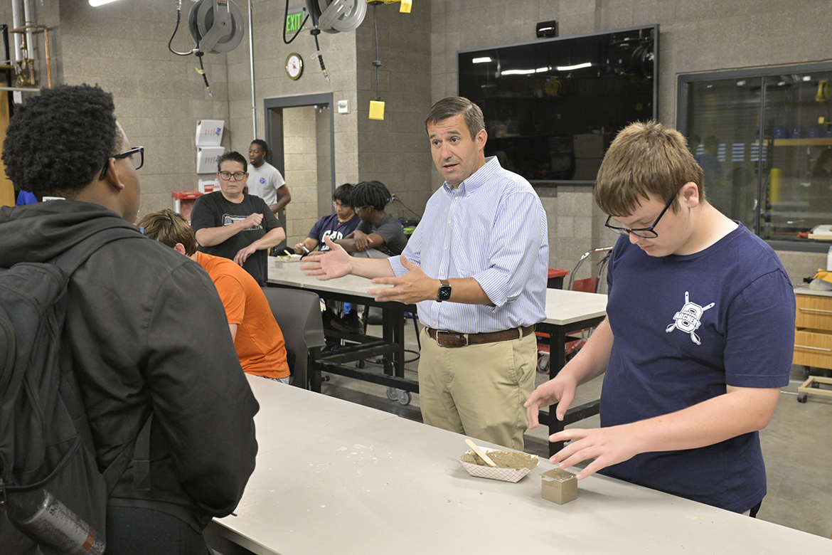 Middle Tennessee State University Concrete Industry Management Director Jon Huddleston, center, explains a concrete process to a 2024 College of Basic and Applied Sciences STEM Camp participant as camper Haven Rising, right works on his project in the concrete cube strength competition in a classroom in the School of Concrete and Construction Management Building on the east side of campus in Murfreesboro, Tenn. The campers wrapped up the five-day event with presentations on Friday, July 19. (MTSU photo by Andy Heidt)