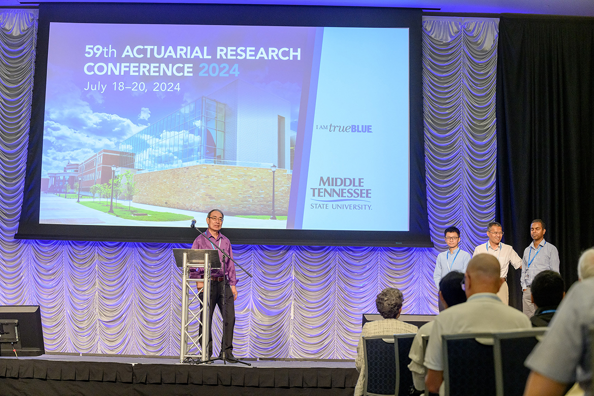 Middle Tennessee State University Mathematical Sciences professor Don Hong, far left, introduces MTSU Center for Actuarial Sciences faculty members, from left, Lu Xiong, Qiang Wu and Vajira Manathunga to participants attending the 59th Actuarial Research Conference, being held July 18-20 at MTSU's Student Union Ballrom on campus in Murfreesboro, Tenn. (MTSU photo by J. Intintoli)