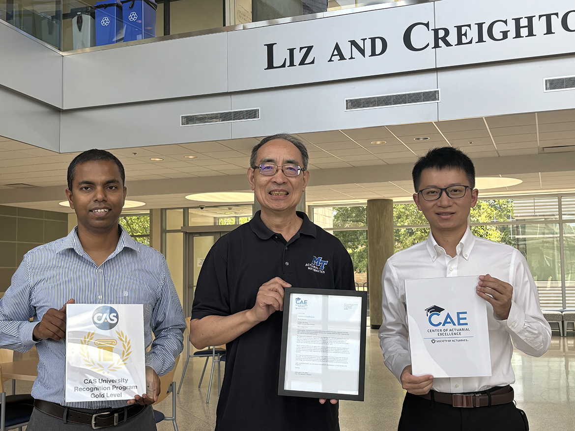 Pictured, from left, inside the Middle Tennessee State University Science Building atrium in Murfreesboro, Tenn., faculty members Vajira Manathunga, Lu Xiong, and Don Hong hold documents related to the Casualty Actuarial Society Gold Level and the Society of Actuaries Center of Actuarial Science recognitions earned and held since fall 2023 by the university’s Actuarial Science program in the Mathematical Sciences Department. (MTSU photo by Randy Weiler)