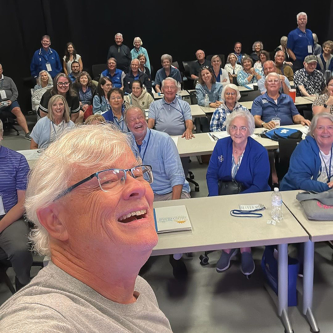 Mike Forbes, foreground, director of technical systems in the Middle Tennessee State University Department of Media Arts, takes a selfie of the 2024 MTSU Alumni Summer College Class of 2024 who attended one of his sessions on artificial intelligence, or AI, recently in the Bragg College of Media and Entertainment Building in Murfreesboro, Tenn. Alumni Relations staff will be surveying alums and formulating a plan for the 16th annual Alumni Summer College in 2025. (MTSU photo by Mike Forbes)