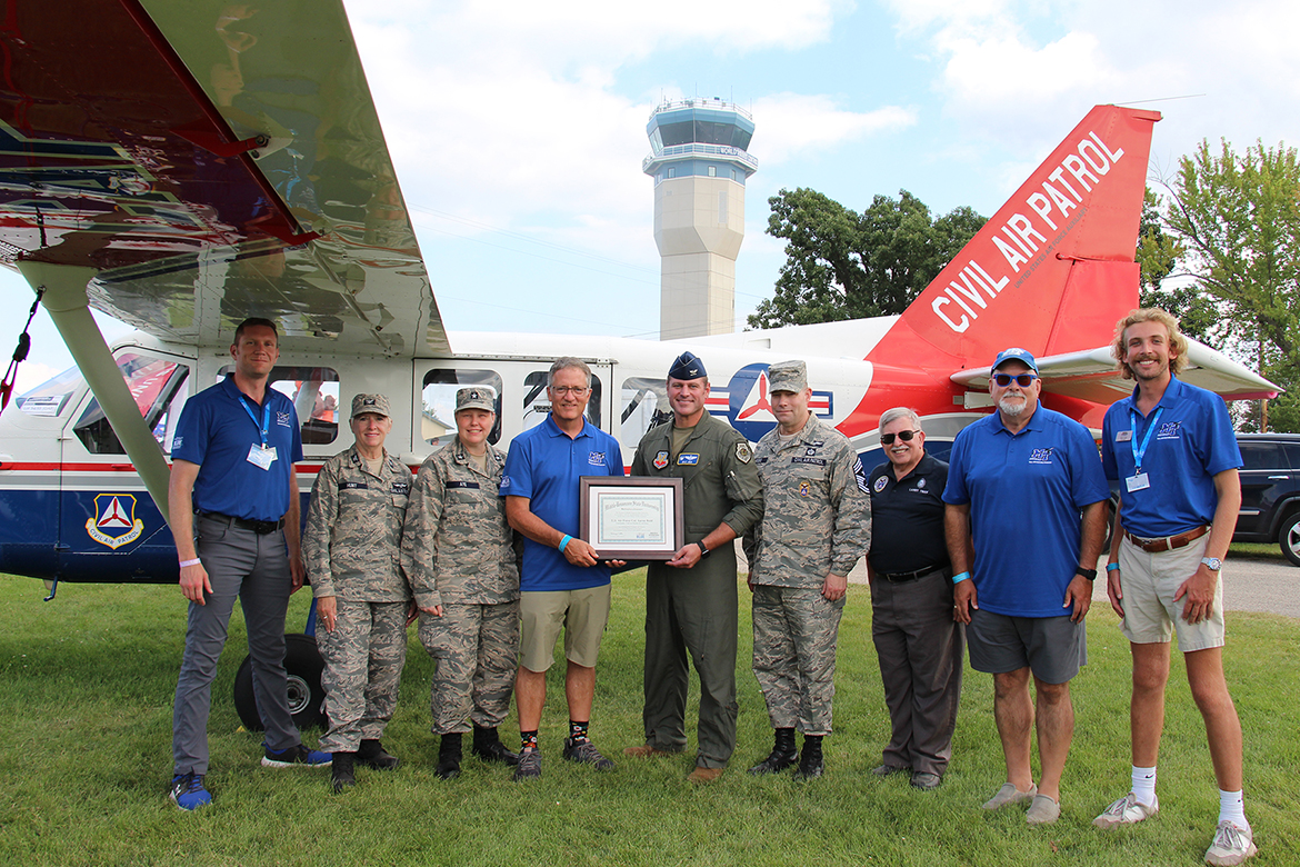 Middle Tennessee State University Provost Mark Byrnes, center left, poses with U.S. Air Force Col. Aaron Reid, along with CAP National Vice Commander Brig. Gen. Regena Aye, left of Byrnes; CAP Great Lakes Region Commander Col. Rose Hunt, left of Aye; CAP Command Chief Todd Parsons, right of Reid, and members of MTSU Aerospace team. (MTSU photo by Brian Delaney)