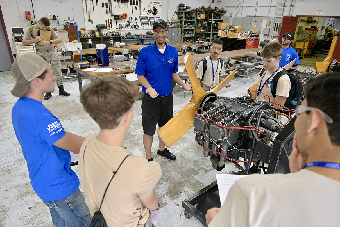 A group of Civil Air Patrol cadets from across the country learn about the maintenance being performed on airplane engines Monday, July 8, at Middle Tennessee State University’s Flight Operations Center just off Memorial Boulevard in Murfreesboro, Tenn. The youths are part of the U.S. Air Force volunteer civilian auxiliary’s National Cadet Engineering Technology Academy, also known as E-Tech, which the university has hosted since 2017. (MTSU photo by Andy Heidt)