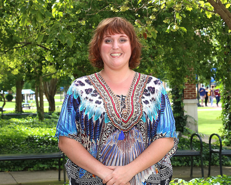 Pictured here outside the Paul W. Martin Sr. Honors Building at Middle Tennessee State University in Murfreesboro, Tenn., MTSU graduate student Rachel Booher was recently selected as a 2024 Marcus L. Urann Fellow by the Honor Society of Phi Kappa Phi, one of only six students nationwide awarded $20,000 to use toward a graduate degree and first MTSU student to receive this award. (MTSU photo)