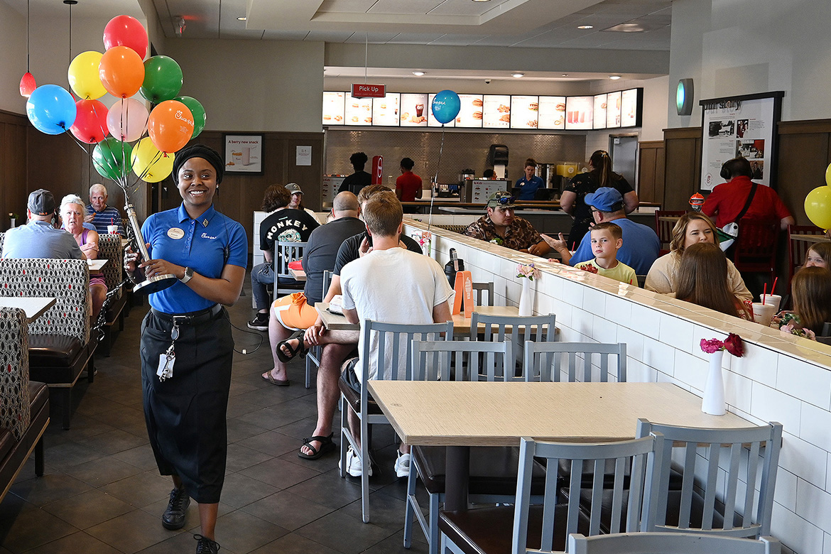 Middle Tennessee State University Tourism and Hospitality Management Program student Kenady Rix, a front counter shift leader and summer operations intern at Chick-fil-A in Murfreesboro, Tenn., carries balloons to give out to customers. Part of her coursework includes working within the industry to gain experience. (MTSU photo by Nancy DeGennaro)