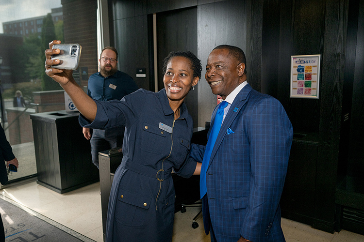 Middle Tennessee State University President Sidney A. McPhee, right, poses for a selfie with Bukola Bakare, assistant management professor in the Jones College of Business, at the 2024 Fall Faculty and Staff Meeting held Thursday, Aug. 22, inside Tucker Theatre on the MTSU campus in Murfreesboro, Tenn. (MTSU photo by Andy Heidt)