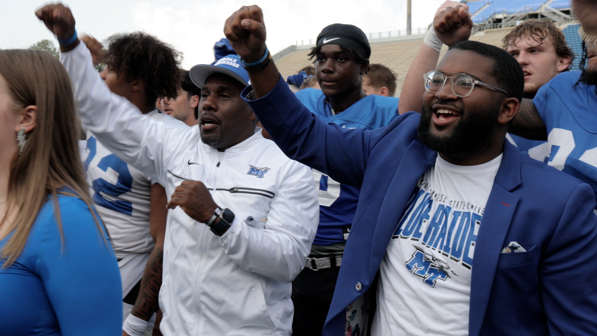 Middle Tennessee State University Student Government Association President Michai Mosby, right, stands next to new Blue Raider Football Head Coach Derek Mason and team captains during the Scholars Academy, held Aug. 22, at Floyd Stadium in Murfreesboro, Tenn. (MTSU photo by James Cessna)