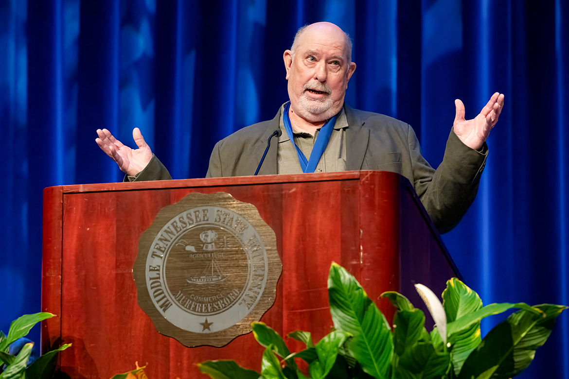 Middle Tennessee State University aerospace professor Paul A. Craig speaks at the annual Fall Faculty and Staff Meeting and State of the University Address after being honored by the MTSU Foundation for the 2024 Career Achievement Award. (MTSU photo by Andy Heidt)