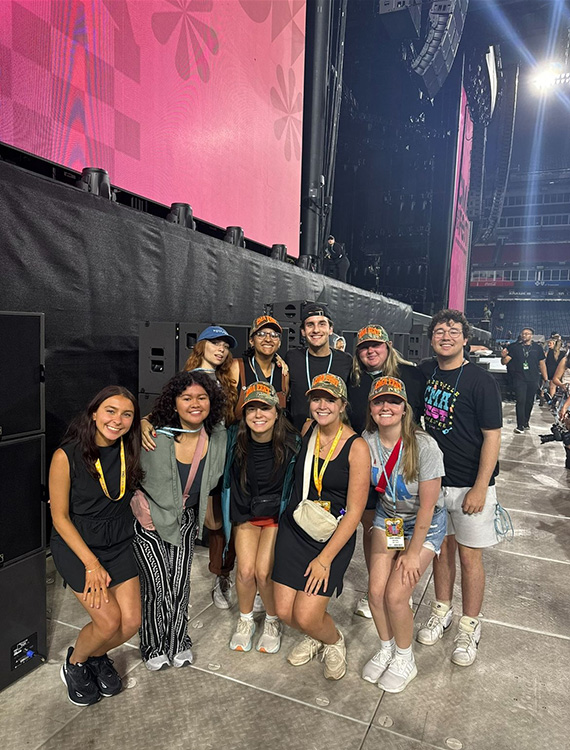 In this undated photo, Middle Tennessee State University alumna and recording industry graduate Liliana Manyara stands in front of the stage with other Country Music Association interns at the annual CMA Fest before the opening artist takes the stage at Nissan Stadium in Nashville, Tenn. (Photo submitted)