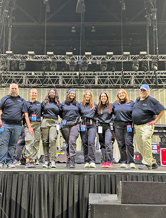 Middle Tennessee State University alumna and spring recording industry graduate Liliana Manyara, fourth from the left, stands on the stage along with other members of the MTSU Signature Events committee who booked singer-songwriter Khalid for the 2024 spring concert at MTSU’s Murphy Center in Murfreesboro, Tenn. (Photo submitted)