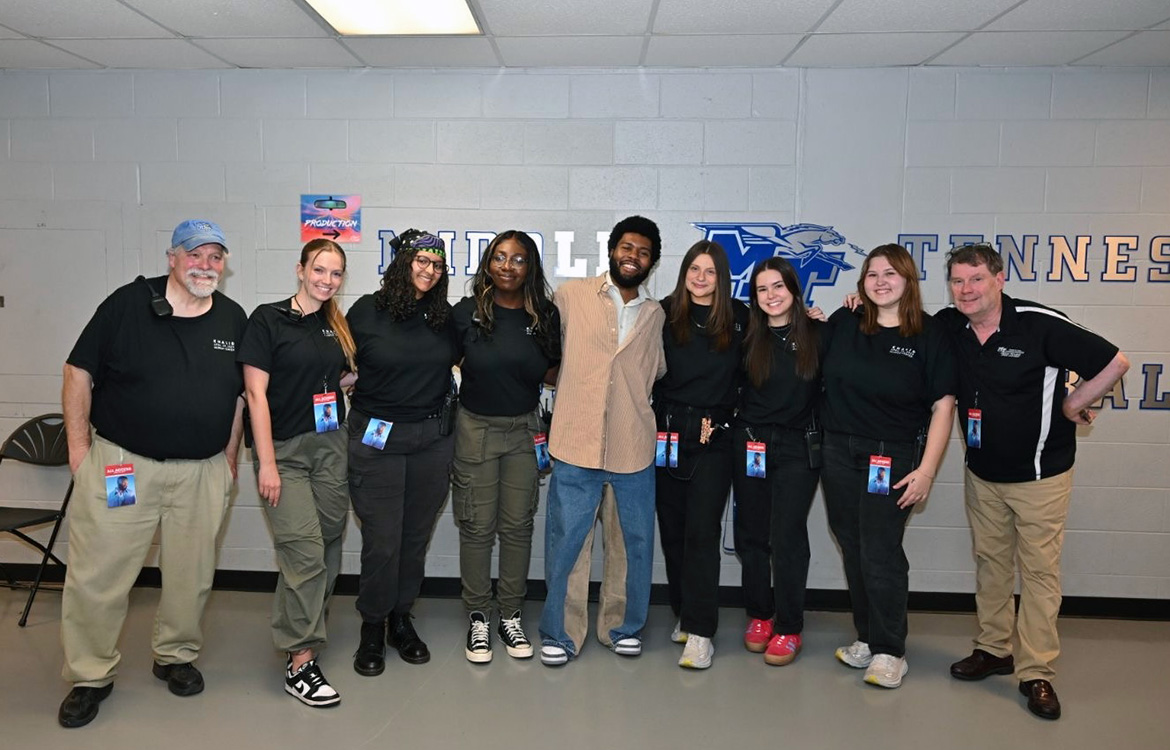 Middle Tennessee State University alumna and recording industry graduate Liliana Manyara, third from left, poses for a photo with other members of the MTSU Signature Events committee and singer-songwriter Khalid backstage before his performance at MTSU’s Murphy Center in Murfreesboro, Tenn. 