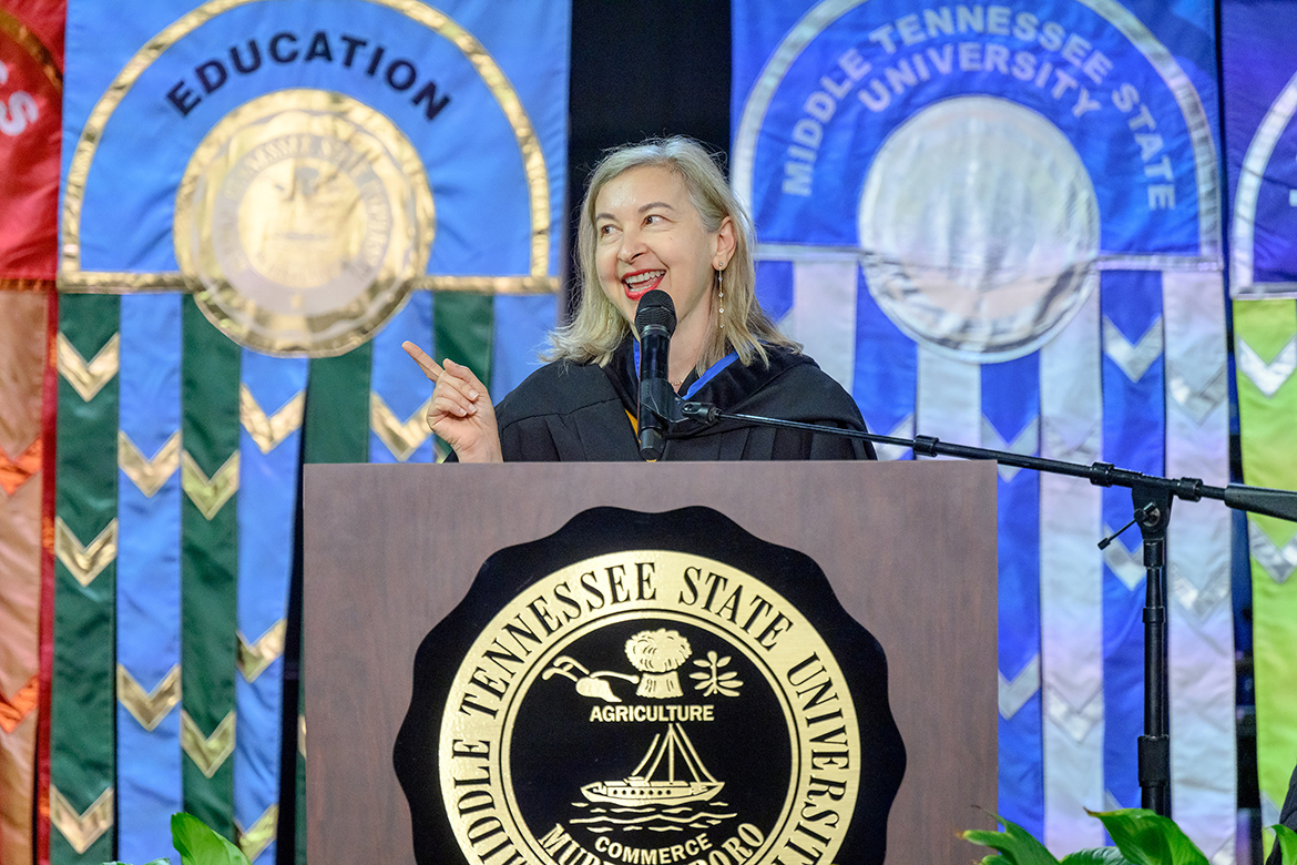 Firoozeh Dumas, author of the Middle Tennessee State University summer reading book for new students, gestures to the audience while speaking Saturday, Aug. 24, in Murphy Center in Murfreesboro, Tenn., during University Convocation. Dumas wrote “Laughing Without an Accent: Adventures of a Global Citizen,” a New York Times bestseller. (MTSU photo by J. Intintoli)