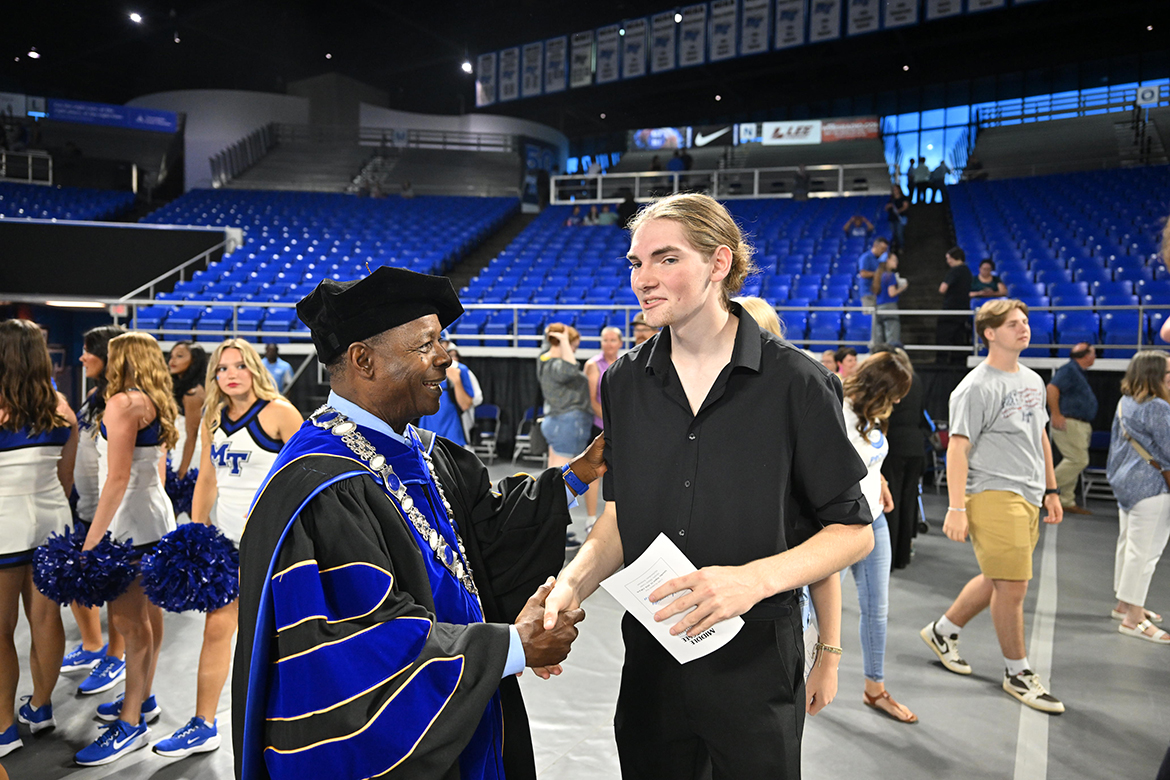 Middle Tennessee State University President Sidney A. McPhee visits with a new student Saturday, Aug. 24, following the 23rd annual University Convocation in Murphy Center in Murfreesboro, Tenn. (MTSU photo by James Cessna)