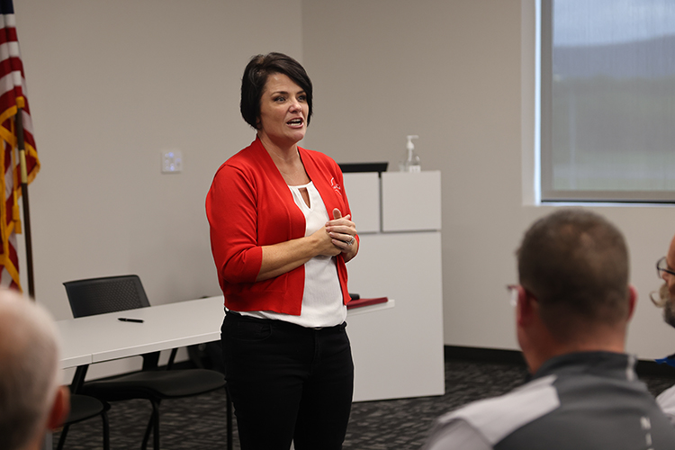 Middle Tennessee State University alumna Joy Rich, Nissan’s manager of community relations and coordinator of Nissan’s Centers of Excellence, speaks to community partners and other attendees at Nissan’s Partners in Education Signing Day event on July 29, 2024, at the automaker’s manufacturing plant in Decherd, Tenn. MTSU College of Education faculty is helping train Nissan employees to teach career technical training courses full time at the centers housed in nearby high schools. (Submitted photo)