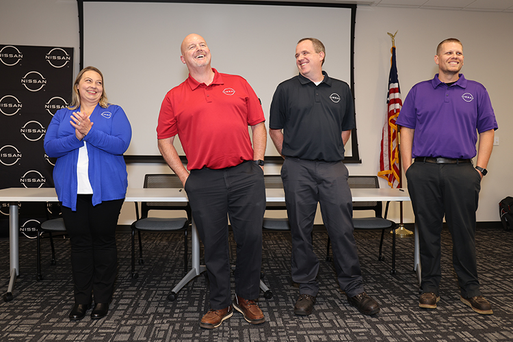 Nissan employees speak about becoming career technical educators and teaching advanced automotive skills in local high schools this fall at Nissan’s Partners in Education Signing Day event on July 29, 2024, at the automaker’s manufacturing plant in Decherd, Tenn. Pictured, from left, is Nissan’s Cassandra Rhodes from Warren County High School, Jamie Nunley from Tullahoma High School, Daniel Keele from Franklin County High School, and Bradley Cook from Grundy County High School. MTSU College of Education faculty taught the employees to teach the courses. (Submitted photo)