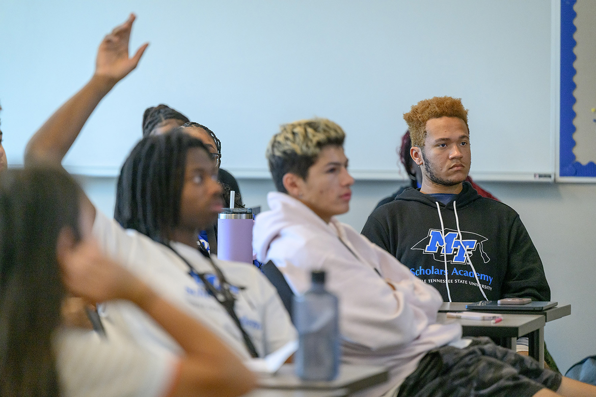 New Middle Tennessee State University students including Cameron Gallaher, right, of Kingston, Tenn., listen and ask questions as part of the fall 2024 Scholars Academy Freshman Summer Institute Tuesday, Aug. 13, in a College of Education classroom on the MTSU campus in Murfreesboro, Tenn. Helped by peer mentors and faculty and staff, the students received daily doses of information to make their transition easier as first-year college students. (MTSU photo by J. Intintoli)