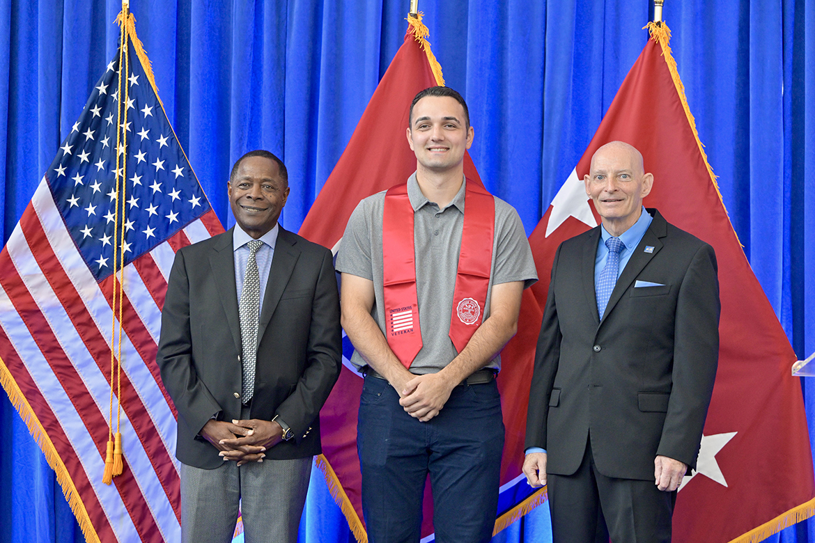 Middle Tennessee State University President Sidney A. McPhee, left, and Keith M. Huber, right, MTSU senior adviser for veterans and leadership initiatives, recognize Arbnon Sulejmani of Gallatin, Tenn., Friday, Aug. 9, during the summer Graduating Veterans Stole Ceremony at the Miller Education Center on Bell Street in Murfreesboro, Tenn. Sulejmani, who served in the U.S. Army, earned a bachelor’s degree in professional studies. (MTSU photo by Andy Heidt)