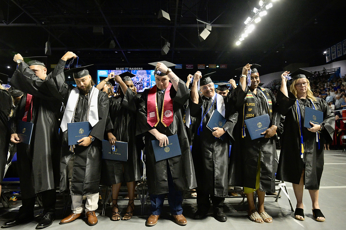 Middle Tennessee State University graduates move their mortarboard tassels from the right to the left at the conclusion of university’s summer 2024 commencement ceremony held Saturday, Aug. 10, inside Murphy Center on the MTSU campus in Murfreesboro, Tenn. More than 770 graduates received their degrees. (MTSU photo by Andy Heidt)