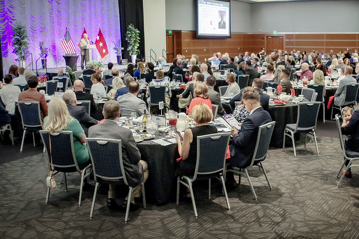 The large crowd attending the seventh annual Veteran Impact Celebration listens as Tommy Baker, Tennessee Department of Veterans Affairs commissioner, accepts the Community Partner Award recently in Middle Tennessee State University’s Student Union Ballroom in Murfreesboro, Tenn. (MTSU photo by Tom Beckwith)