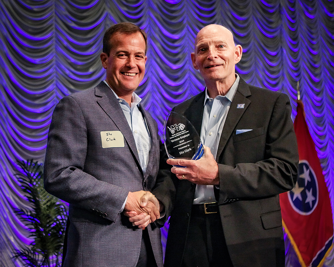 Stu Clark, left, CEO of Premise Health, receives the 2024 Veteran Employer Award from retired Lt. Gen. Keith M. Huber, Middle Tennessee State University senior adviser for veterans and leadership initiatives, recently in the Student Union Ballroom in Murfreesboro, Tenn., during the Veteran Impact Celebration, a fundraiser for the Charlie and Hazel Daniels Veterans and Military Family Center. (MTSU photo by Tom Beckwith)