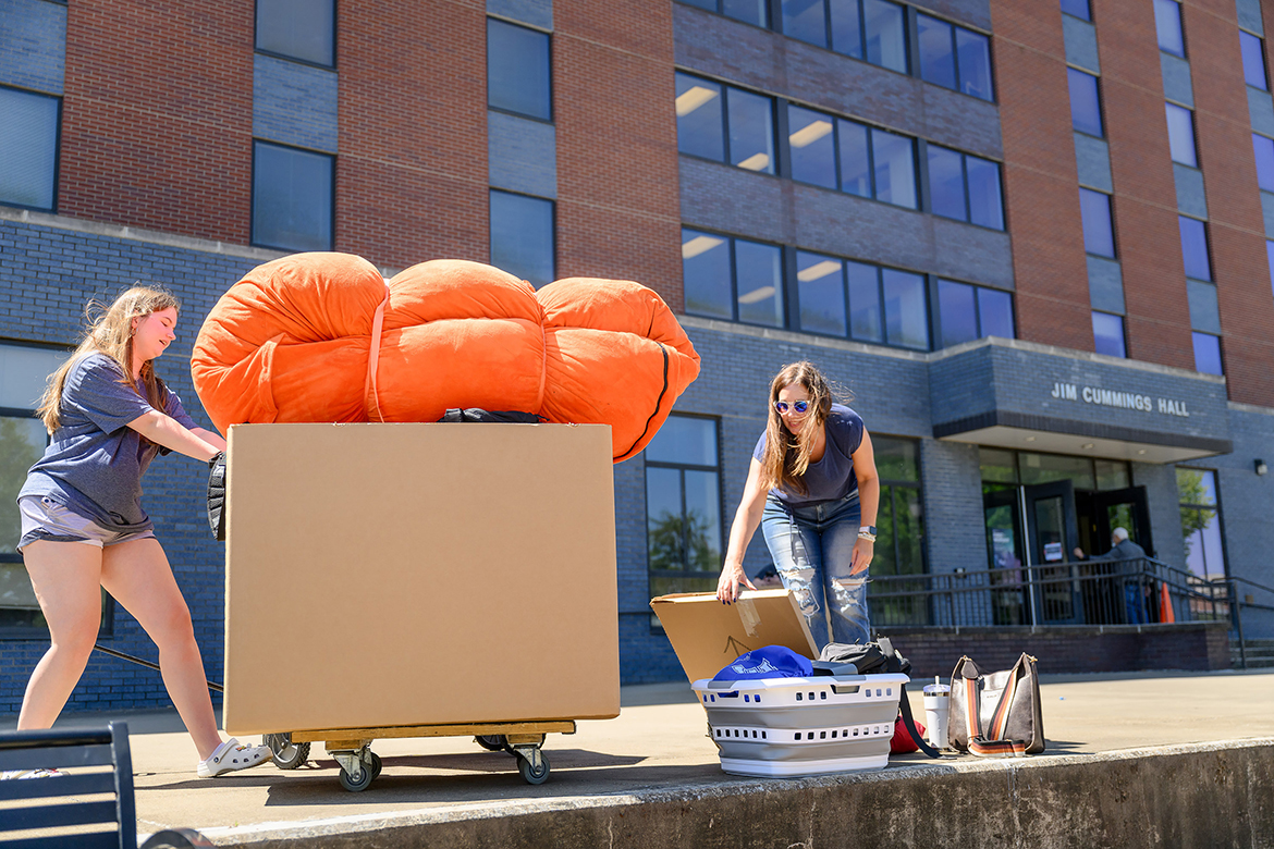 With assistance from her mother, right, a new Middle Tennessee State University freshman uses a cart to move in part of her belongings Wednesday, Aug. 21, at Jim Cummings Hall on the MTSU campus in Murfreesboro, Tenn. MTSU dorms are at peak capacity for the fall 2024 semester. (MTSU photo by J. Intintoli)