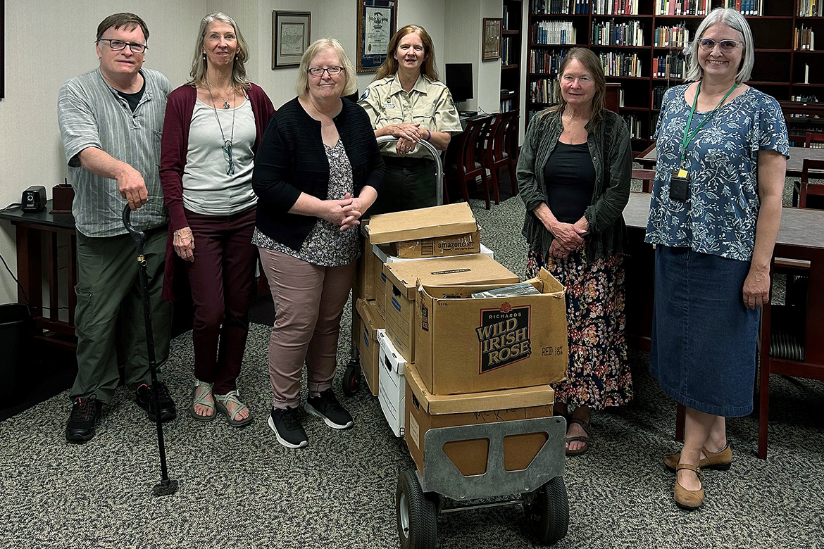 The Special Collections Department in James E. Walker Library at Middle Tennessee State University in Murfreesboro, Tenn., welcomed a donation of books, postcards and papers from the family of legendary Tennessee environmentalist Mack Prichard and the nonprofit Mack Prichard Foundation. Standing with the collection is, from left, John Froeschauer, retired Middle Tennessee regional interpretive specialist; MTSU biology professor Kim Sadler; Susan Hanson, Special Collections curator; Leslie Anne Allen, Long Hunter State Park ranger; Lisa Luck, president of the Mack S. Prichard Foundation; and Susan Martin, Special Collections librarian. (Submitted photo)