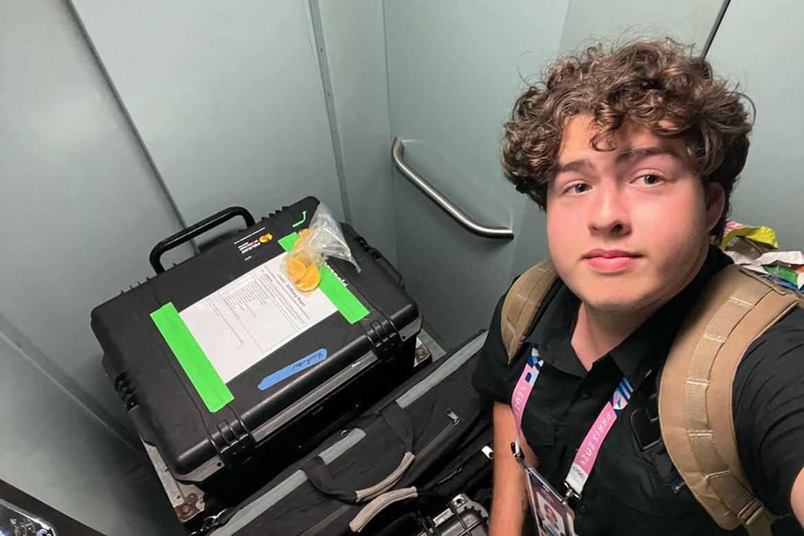 Tobin Smith, a senior video and film production major at Middle Tennessee State University in Murfreesboro, Tenn., spent nearly a month in Paris, France, over the summer working production for NBC Sports for the 2024 Olympics. He is pictured here with some of the gear he was responsible for transporting to different locations as part of sportscaster Maria Taylor’s late night sports program. (Photo submitted)