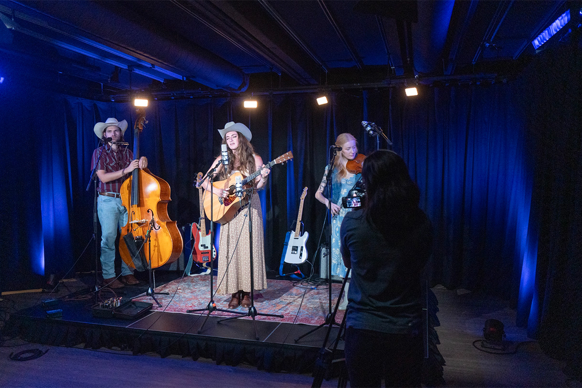 In this undated photo, Americana singer Chloe Kimes performs onstage at WMOT-FM Roots Radio 89.5's satellite broadcast and production studio at the Riverside Revival events venue located at 1610 Porter Road in East Nashville, Tenn. Kimes is a graduate from the Commercial Songwriting program in Middle Tennessee State University's College of Media and Entertainment. (Photo by Val Hoeppner/WMOT)