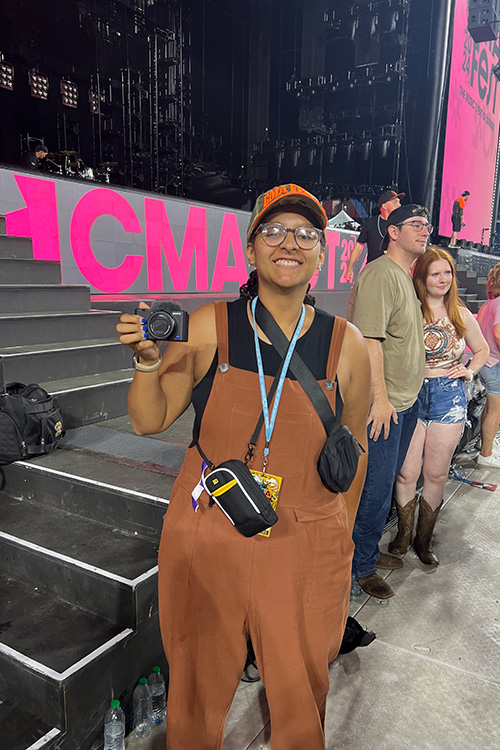 In this undated photo, Middle Tennessee State University alumna and recording industry graduate Liliana Manyara stands in front of the stage with other Country Music Association interns at the annual CMA Fest before the opening artist takes the stage at Nissan Stadium in Nashville, Tenn. (Photo submitted)