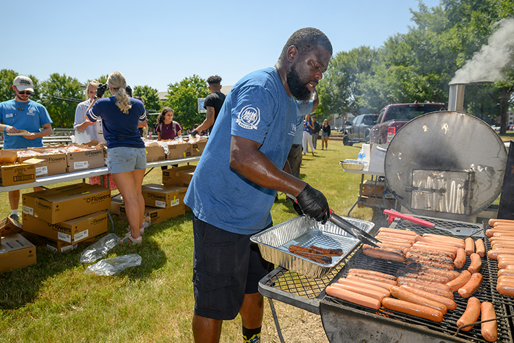 Chris Rochelle, assistant director at the Charlie and Hazel Daniels Veterans and Military Family Center, mans the grill at the Back to School Bonanza held Aug. 26 on the Student Union Commons on the east side of the MTSU campus in Murfreesboro, Tenn. The event featured free food, games, music, carousel rides and more. (MTSU photo by J. Intintoli)