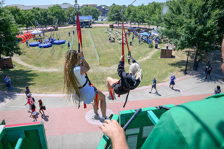 Middle Tennessee State University students enjoy zip lining at the Back to School Bonanza held Aug. 26 on the Student Union Commons on the east side of the MTSU campus in Murfreesboro, Tenn. (MTSU photo by J. Intintoli)