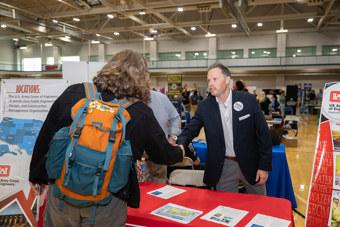 A Middle Tennessee State University student shakes hands with Trey Church, a representative for the U.S. Army Corps of Engineers, one of the 235 companies at the Career Development Center’s 2024 Big Career Fair on Thursday, Sept. 26, inside the Campus Recreation Center in Murfreesboro, Tenn. (MTSU photo by James Cessna)