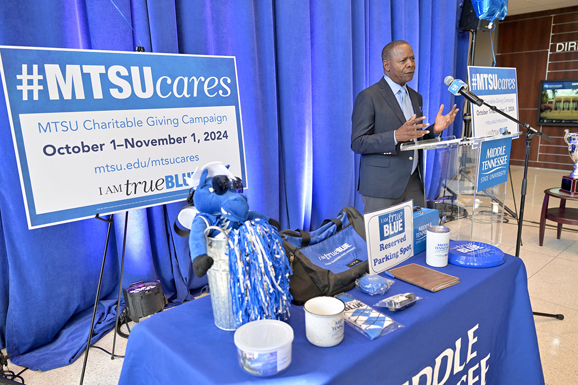 Middle Tennessee State University President Sidney A. McPhee stands beside the table of prizes that participants in this year’s Employee Charitable Giving Campaign have the opportunity to win every Thursday during the monthlong campaign’s weekly prize drawings at the campaign kickoff on Tuesday, Sept. 24, in the Cope Administration Building lobby in Murfreesboro, Tenn. The campaign runs Oct. 1-Nov. 1 with donations made online at mtsu.edu/mtsucares. (MTSU photo by J. Intintoli)