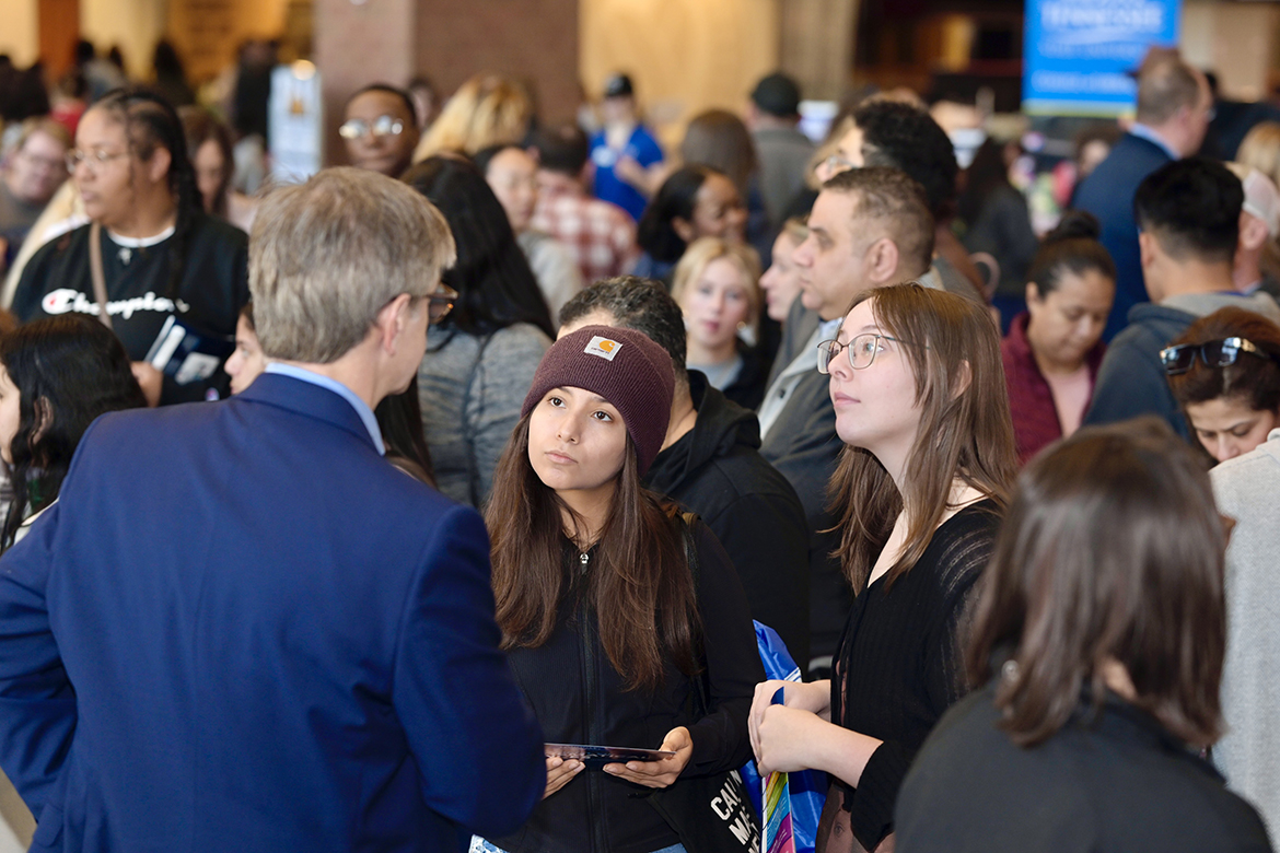 Greg Van Patten, left, Middle Tennessee State University College of Basic and Applied Sciences dean, discusses the college’s programs and answers questions with prospective students in the crowded Student Union first floor atrium during the March 2024 True Blue Preview day on the MTSU campus in Murfreesboro, Tenn. Prospective high school and transfer students and their families are welcome to attend free Saturday preview day events this fall on Sept. 28 and Nov. 2, when they also can apply for free. (MTSU file photo by Cat Curtis Murphy)