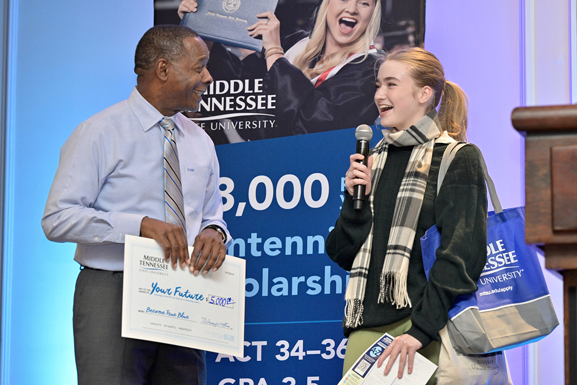 MTSU President Sidney A. McPhee, left, listens to a prospective student talk about her academic interests while awarding her a scholarship during a previous True Blue Tour event at the Franklin Marriott Cool Springs in Franklin, Tenn. McPhee will lead the MTSU recruiting team on the 13-city fall tour starting Wednesday, Sept. 11, in the MTSU Student Union Ballroom in Murfreesboro, Tenn. (MTSU file photo by Andy Heidt)