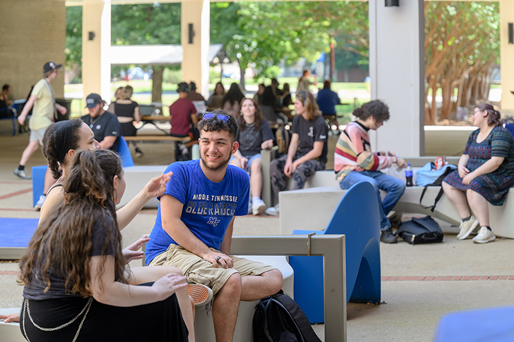 Middle Tennessee State University students relax outside Peck Hall in between classes Aug. 26, the first day of classes for the fall 2024 on the Murfreesboro, Tenn., campus. MTSU’s fall enrollment of 20,540 students is up 1.7% year over year. (MTSU photo by J. Intintoli)