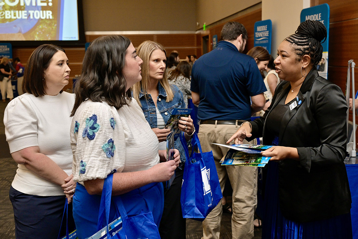 Christina Cobb, associate professor of math at Middle Tennessee State University in Murfreesboro, Tenn., talks with high school counselors who attended the kickoff luncheon for the 2024 True Blue Tour student recruitment event held Wednesday, Sept. 11, in the Student Union Ballroom on campus. (MTSU photo by Andy Heidt)