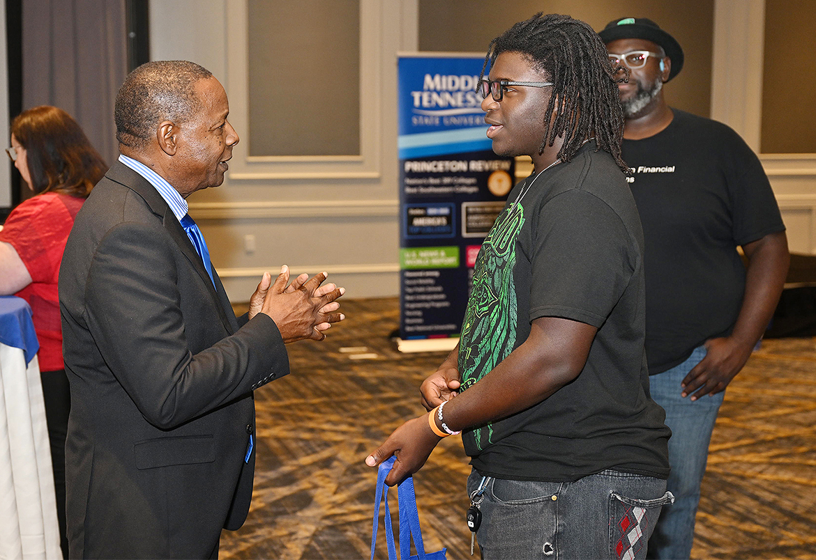 Middle Tennessee State University President Sidney A. McPhee, left, talks with a prospective Blue Raider during a True Blue Tour student recruitment event held Wednesday, Sept. 25, at the Marriott Hotel in Franklin, Tenn. (MTSU photo by James Cessna)