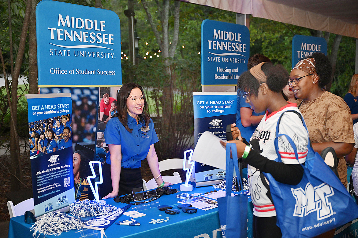 Monique Ward, left, assistant director of the Scholars Academy at Middle Tennessee State University in Murfreesboro, Tenn., talks with prospective student Athasia Joyner, a senior at Cane Ridge High School in Antioch, Tenn., at the university’s True Blue Tour student recruitment event held Wednesday, Sept. 18, at the Nashville Zoo. The high schooler is interested in MTSU’s renowned Forensic Science Program and won a $1,000 scholarship during a giveaway led by university President Sidney A. McPhee. (MTSU photo by James Cessna)