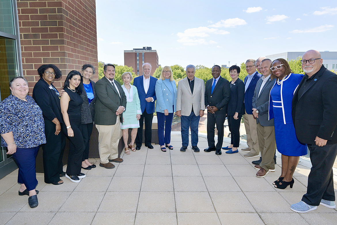 Middle Tennessee State University President Sidney A. McPhee, center right, is joined by other university representatives on the balcony of the Student Union Building to welcome Zahi Hawass, center, former Minister of State for Antiquities Affairs in Egypt, and 18 incoming exchange students from American University in Cairo who are studying this fall at MTSU in Murfreesboro, Tenn., as part of the U.S. Agency for International Development, or USAID, Scholars Activity Program. (Submitted photo)