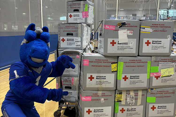 Lightning, Middle Tennessee State University’s mascot, poses with American Red Cross blood donations at the “100 Miles of Hope” blood drive competition on Monday, Sept. 9, the first day of the drive, in the Campus Recreation Center gymnasium in Murfreesboro, Tenn. MTSU beat WKU by collecting 405 units while WKU collected 369 units. (MTSU photo by Maddy Williams)