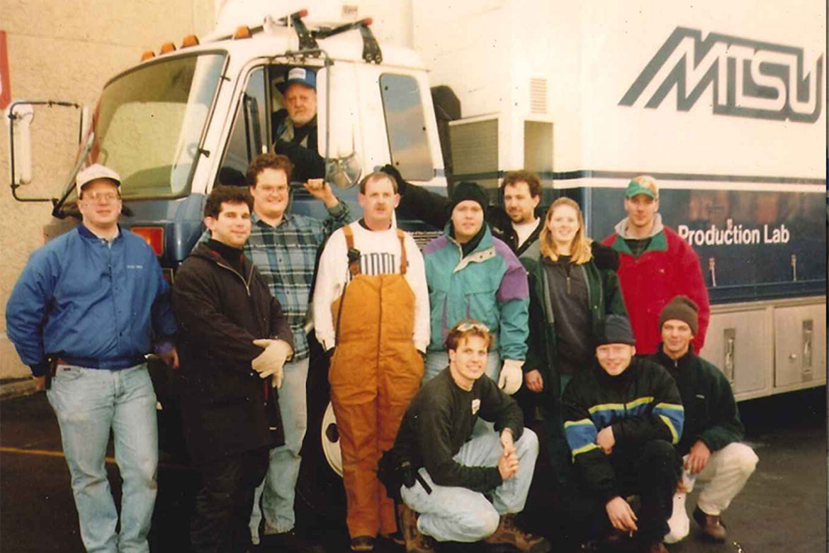 In this undated photo, Middle Tennessee State University alumnus Nic Dugger poses with classmates and professors in front of the university’s original production truck, known as “Old Blue,” in 1998. (Photo submitted)