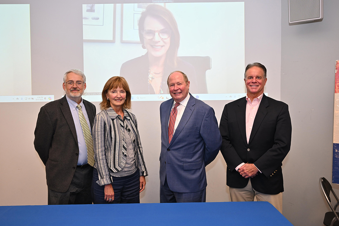 Louis M. Kyriakoudes, left, director of the Albert Gore Research Center at Middle Tennessee State University, is pictured with prominent Tennessee public policy leaders who participated in an Oct. 1 panel discussion about political memorabilia and democracy held in Todd Hall on the university campus in Murfreesboro, Tenn. Pictured, from left, are Kyriakoudes; former Tennessee House Speaker and MTSU Distinguished Visiting Professor Beth Harwell; MTSU political science professor Kent Syler; Mark Tipps, former chief of staff for Sen. Bill Frist; and Lisa Quigley, chief of staff for former Rep. Jim Cooper, on screen via videoconference. (MTSU photo by James Cessna)