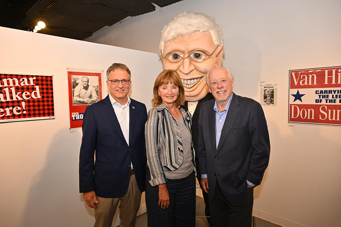 From left, Middle Tennessee State University Provost Mark Byrnes, political science professor; former Tennessee House Speaker and MTSU Distinguished Visiting Professor Beth Harwell; and former Tennessee Gov. Phil Bredesen attend the Oct. 1 exhibit opening inside Todd Gallery on the MTSU campus in Murfreesboro, Tenn. The trio are posing before the “Titular Head,” a humorous representation of the late Don Sundquist, Tennessee governor from 1995-2003, that was used by Bredesen’s 2002 campaign and is part of the exhibit showcasing American democracy through political memorabilia curated by the Albert Gore Research Center. (MTSU photo by James Cessna)