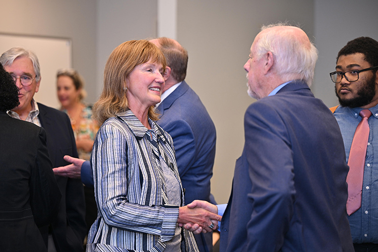 Former Tennessee House Speaker and MTSU Distinguished Visiting Professor Beth Harwell, left, and former Tennessee Gov. Phil Bredesen greet at the Oct. 1 panel discussion and exhibit opening inside Todd Hall on the MTSU campus in Murfreesboro, Tenn. (MTSU photo by James Cessna)