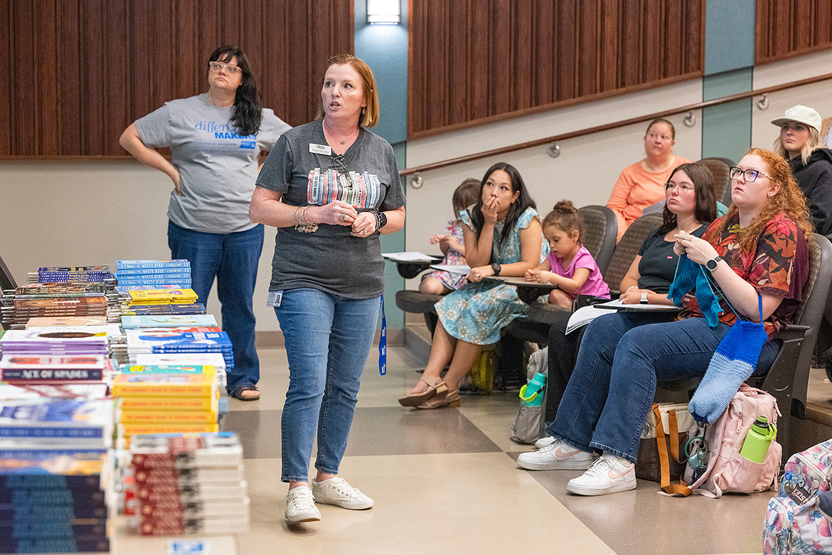 Middle Tennessee State University education faculty member Bonnie Barksdale, center, addresses the rules surrounding banned books to students and parents during “Let Freedom READ” book banning awareness event held Wednesday, Sep. 25, at the College of Education Building in Murfreesboro, Tenn. Looking on, back left, is fellow event organizer and education faculty member Janna McClain. (MTSU photo by Cat Curtis Murphy)